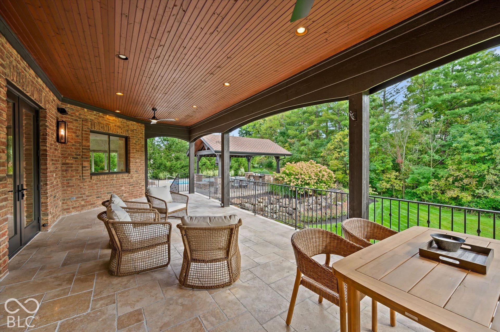 Covered patio featuring a wood-plank ceiling, recessed lighting, and a ceiling fan