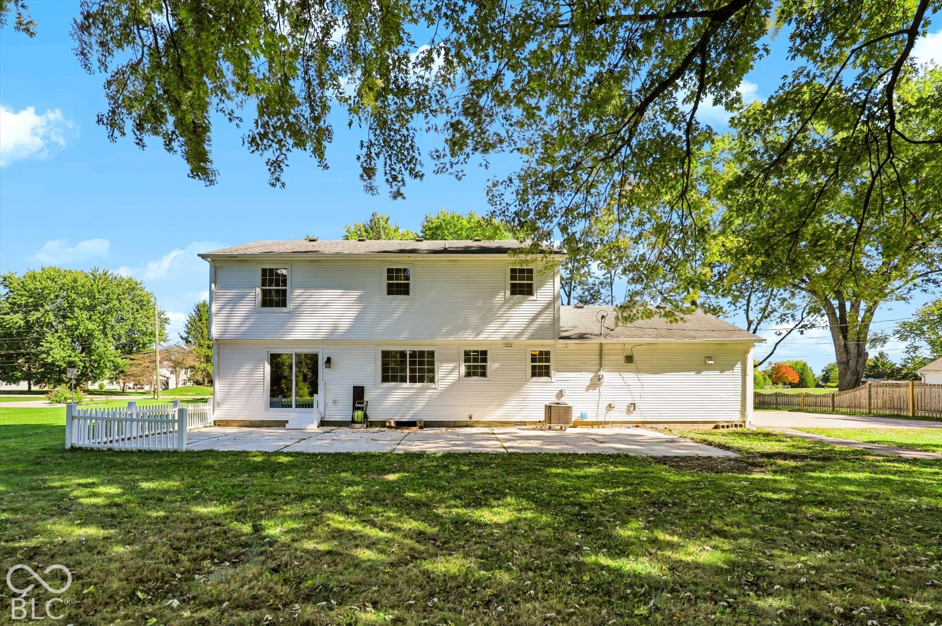 White two-story exterior with multiple windows