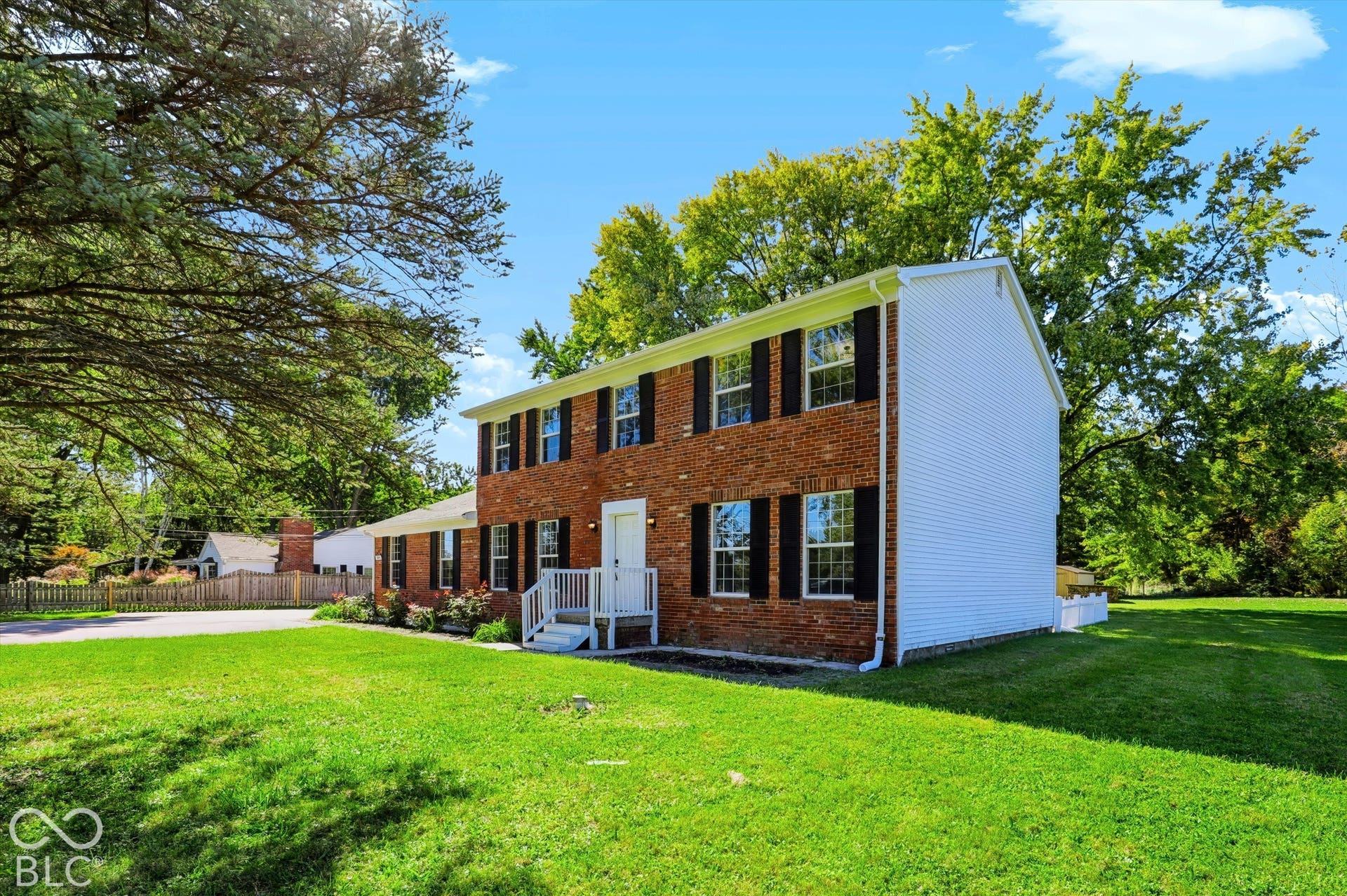 Brick exterior with white siding accents