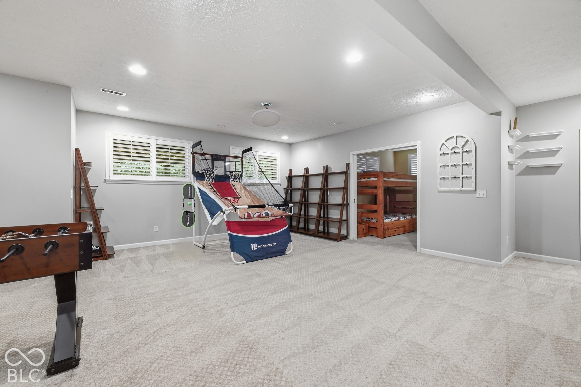 Recessed lighting and a light-toned ceiling create an open atmosphere