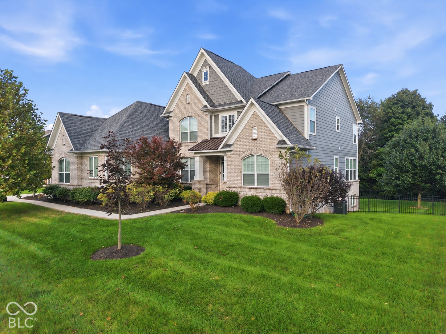 Two-story exterior with a combination of brick and siding