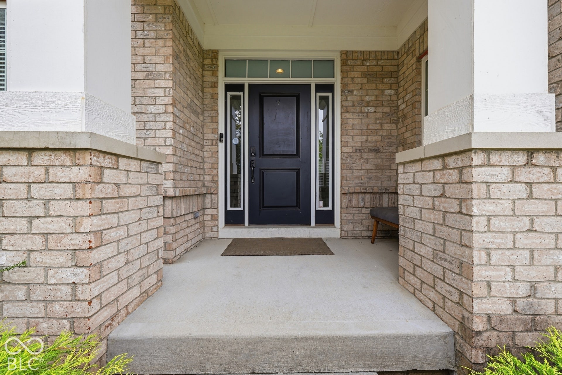 Brick facade with white column accents