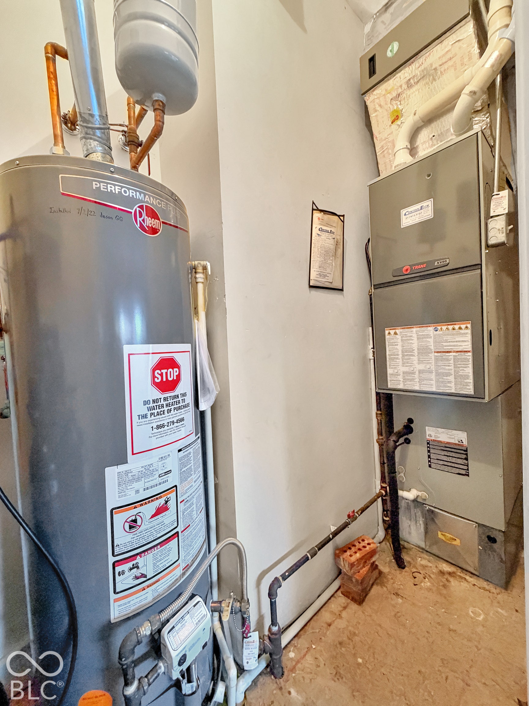 Mechanical closet featuring high-efficiency furnace and water heater installed in 2022.
