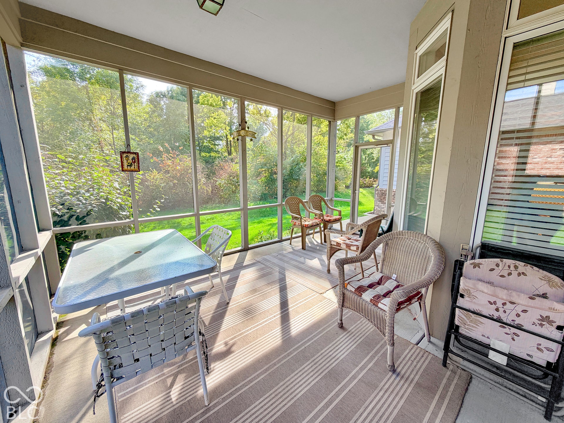 Screened porch featuring direct outdoor access