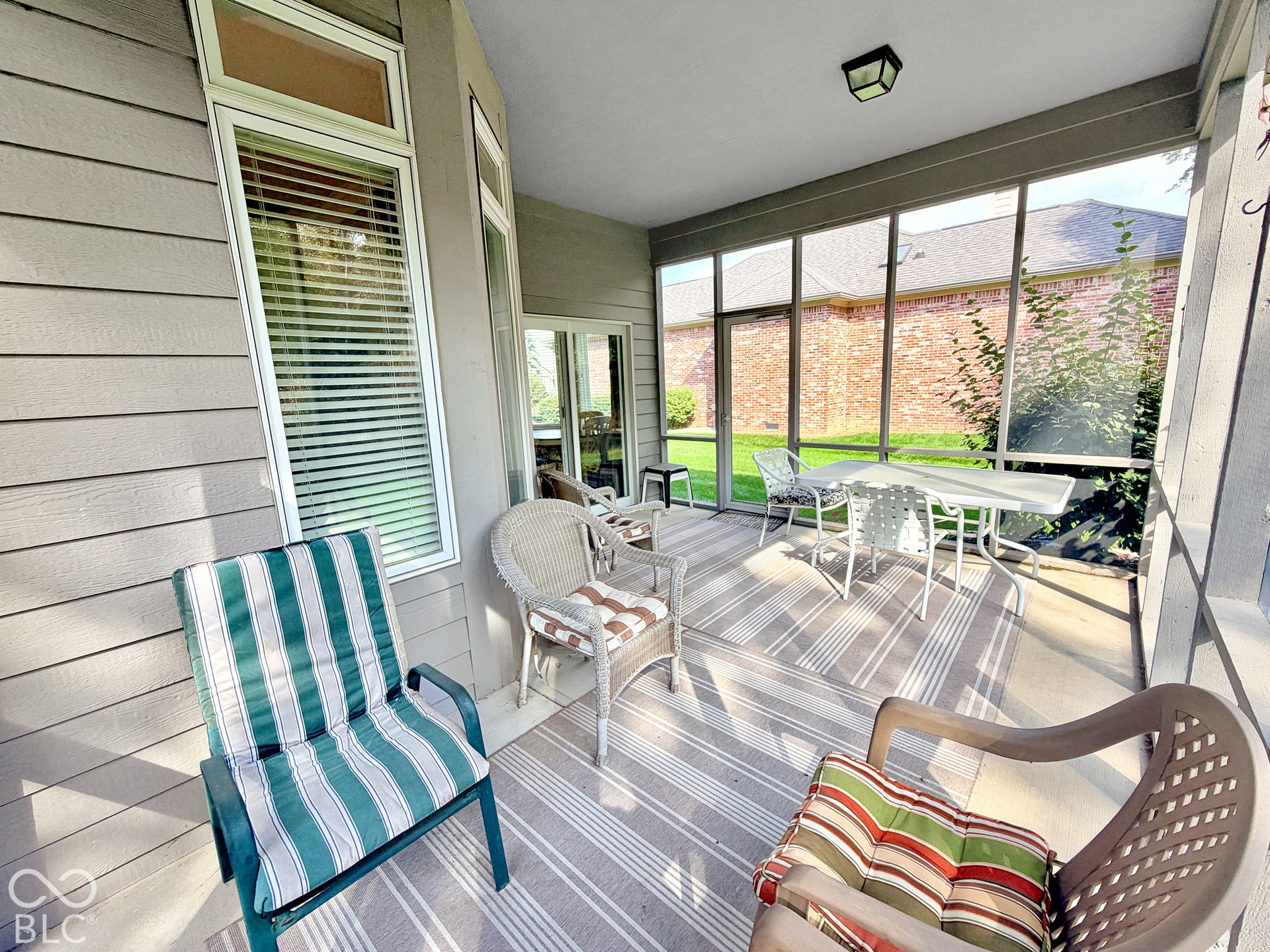 Screened porch featuring direct outdoor access