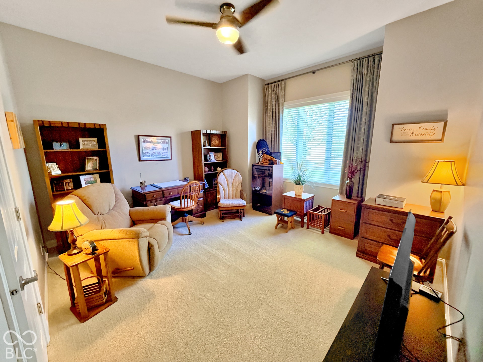 Bedroom 2 with carpeted flooring, vaulted ceiling, ceiling fan with integrated lighting, window with blinds and drapes, and a built-in closet.