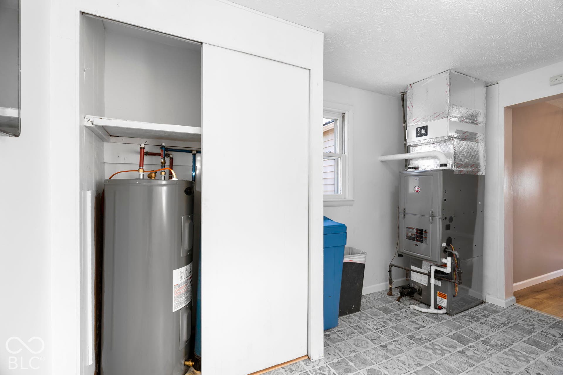 Built-in water heater, furnace system, ductwork, and window
