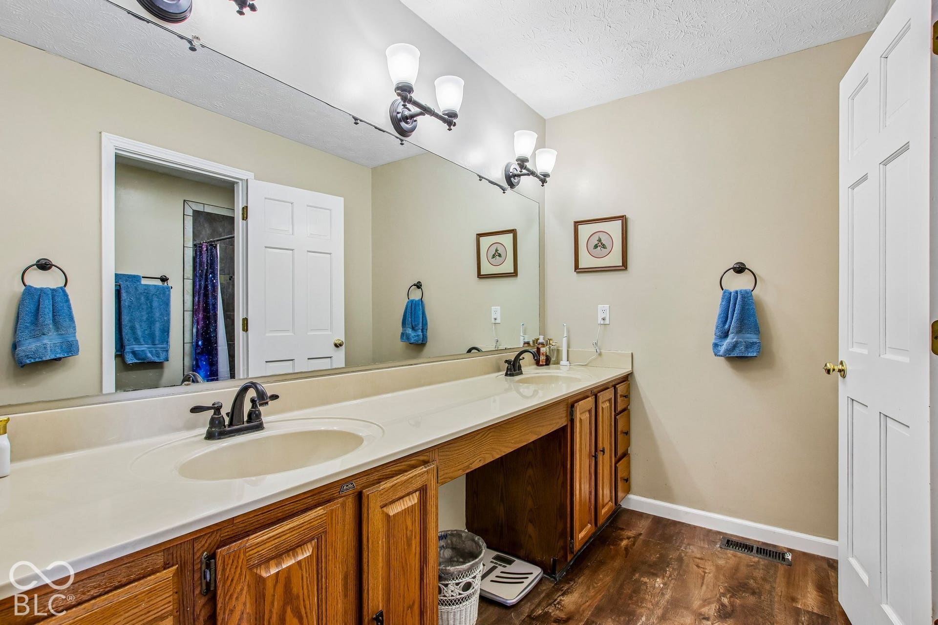 View of updated primary bathroom with dual sinks