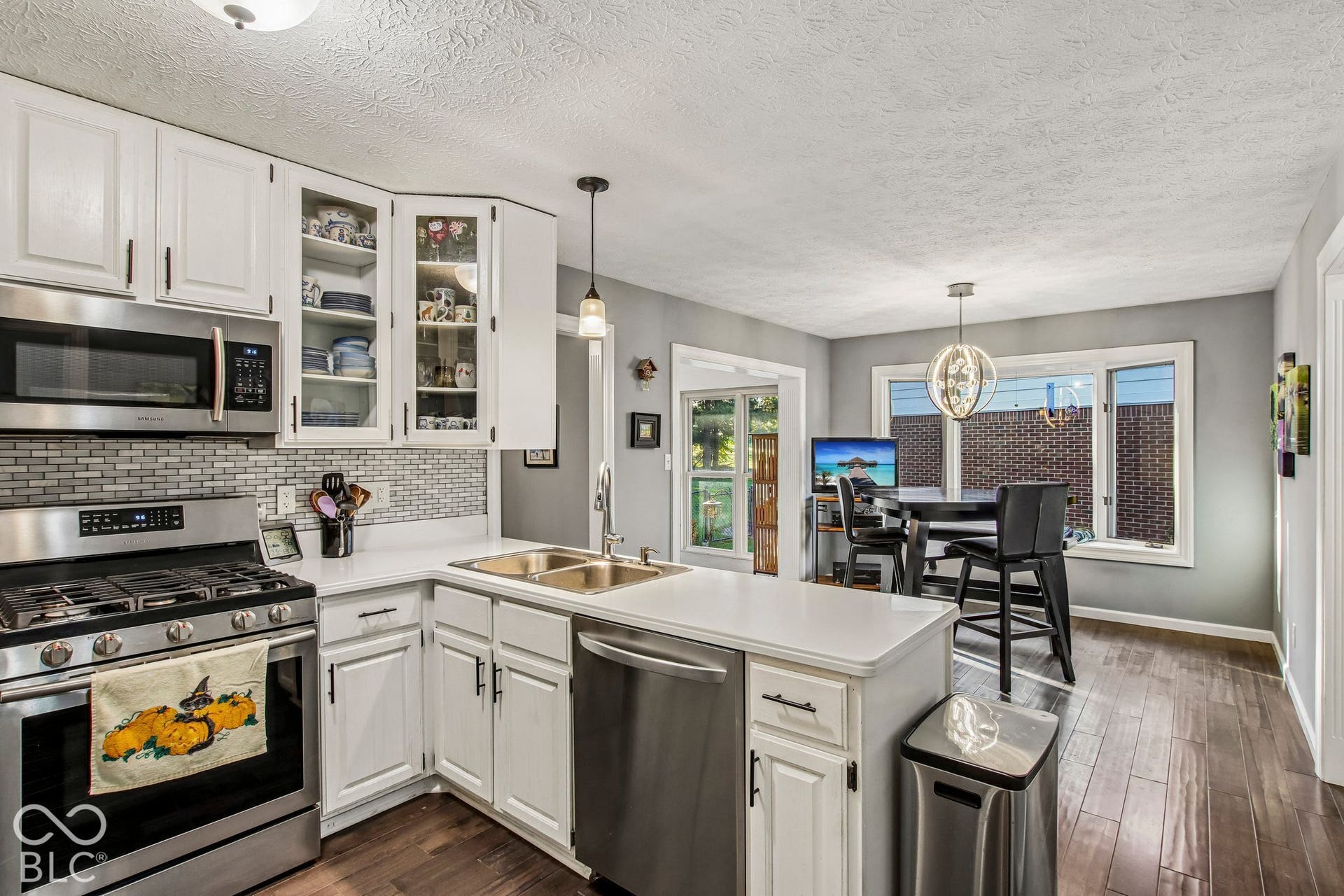 View of fully updated kitchen, dining area and bay window
