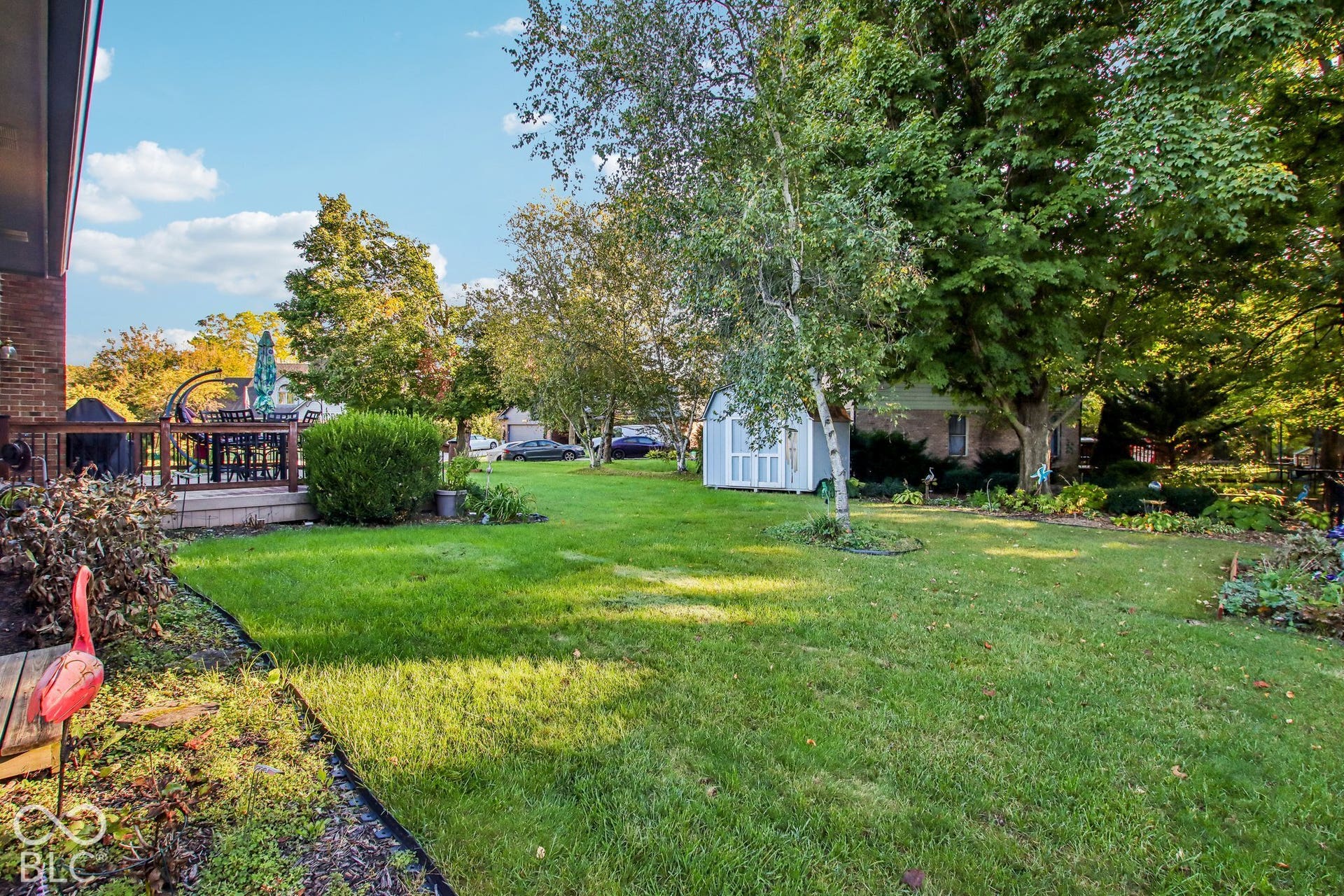 View of back yard with mature trees