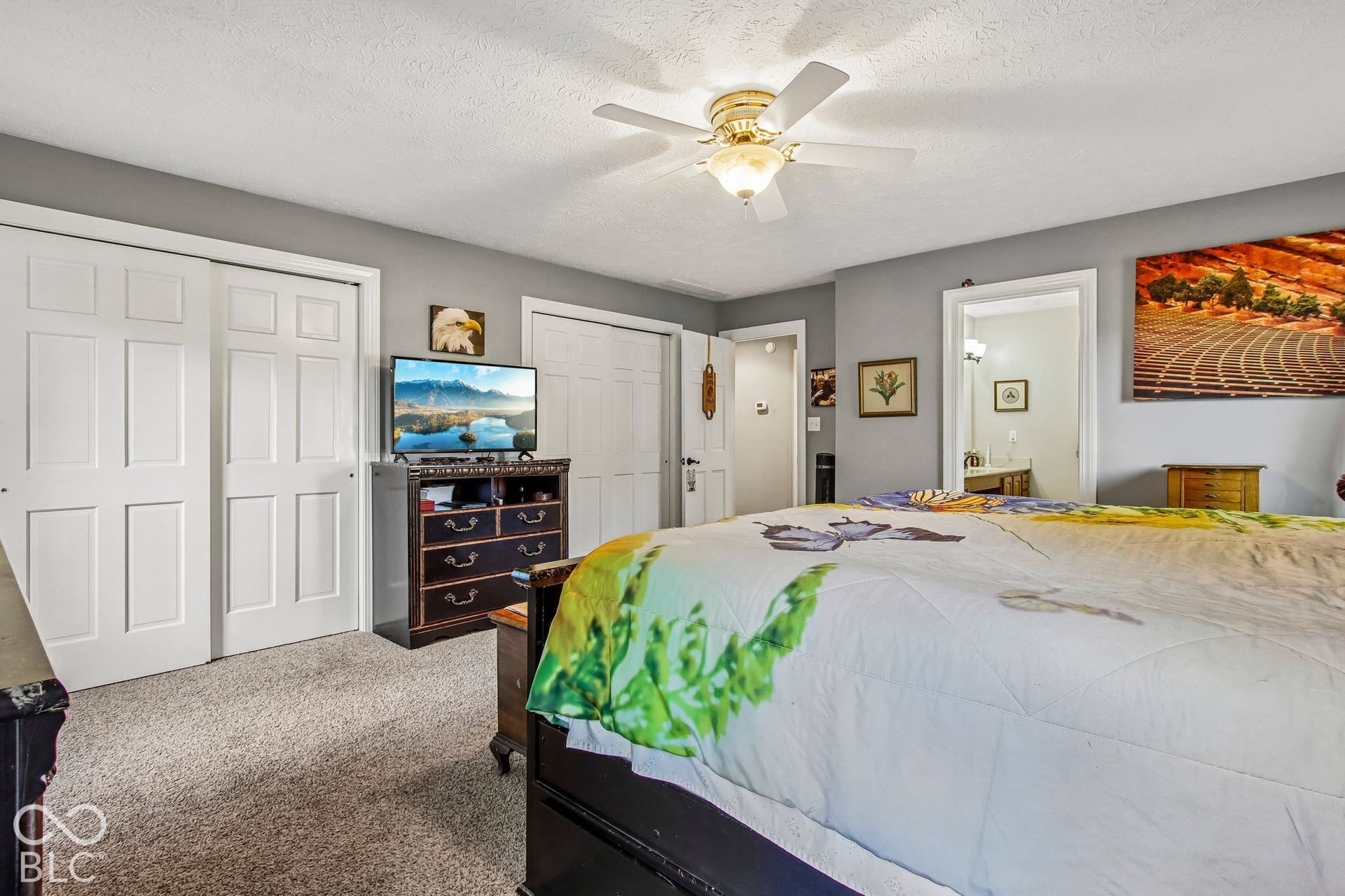 View of updated primary bedroom with 2 FULL closets