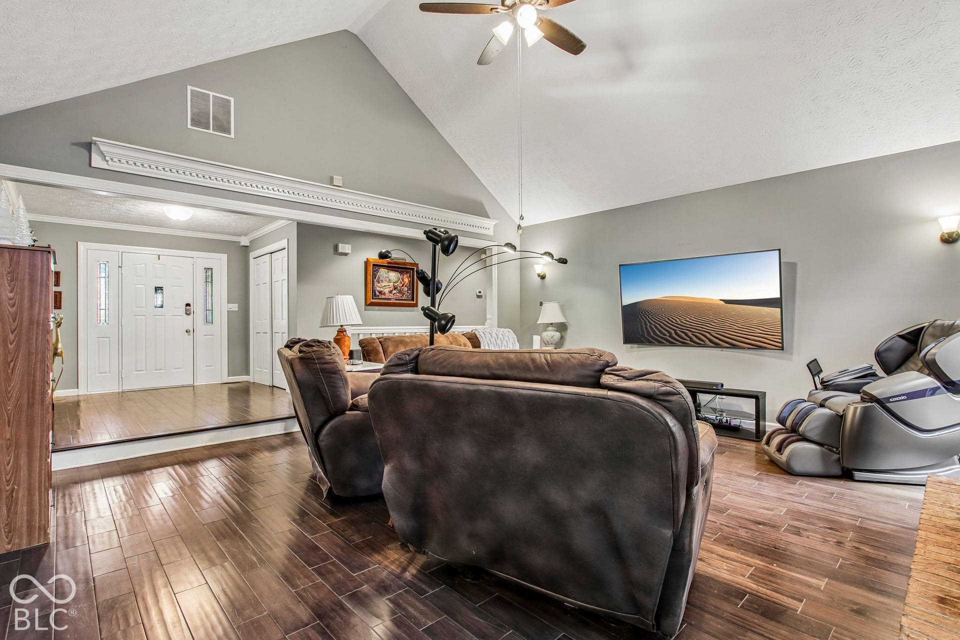 Living Room with 16' ceilings and updated laminate hardwood flooring