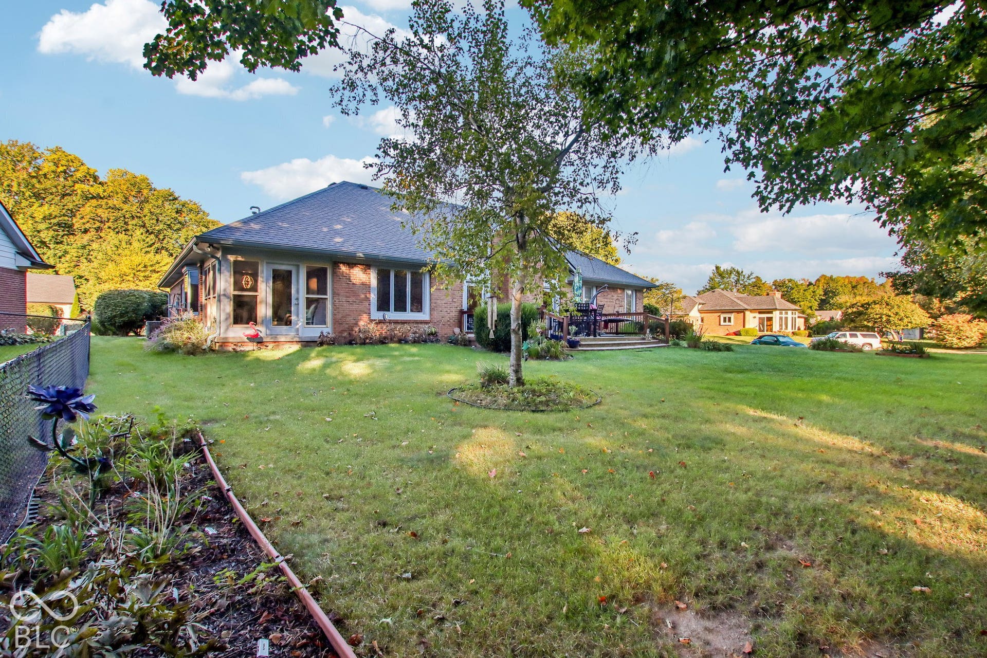 View of rear of home, deck and back yard