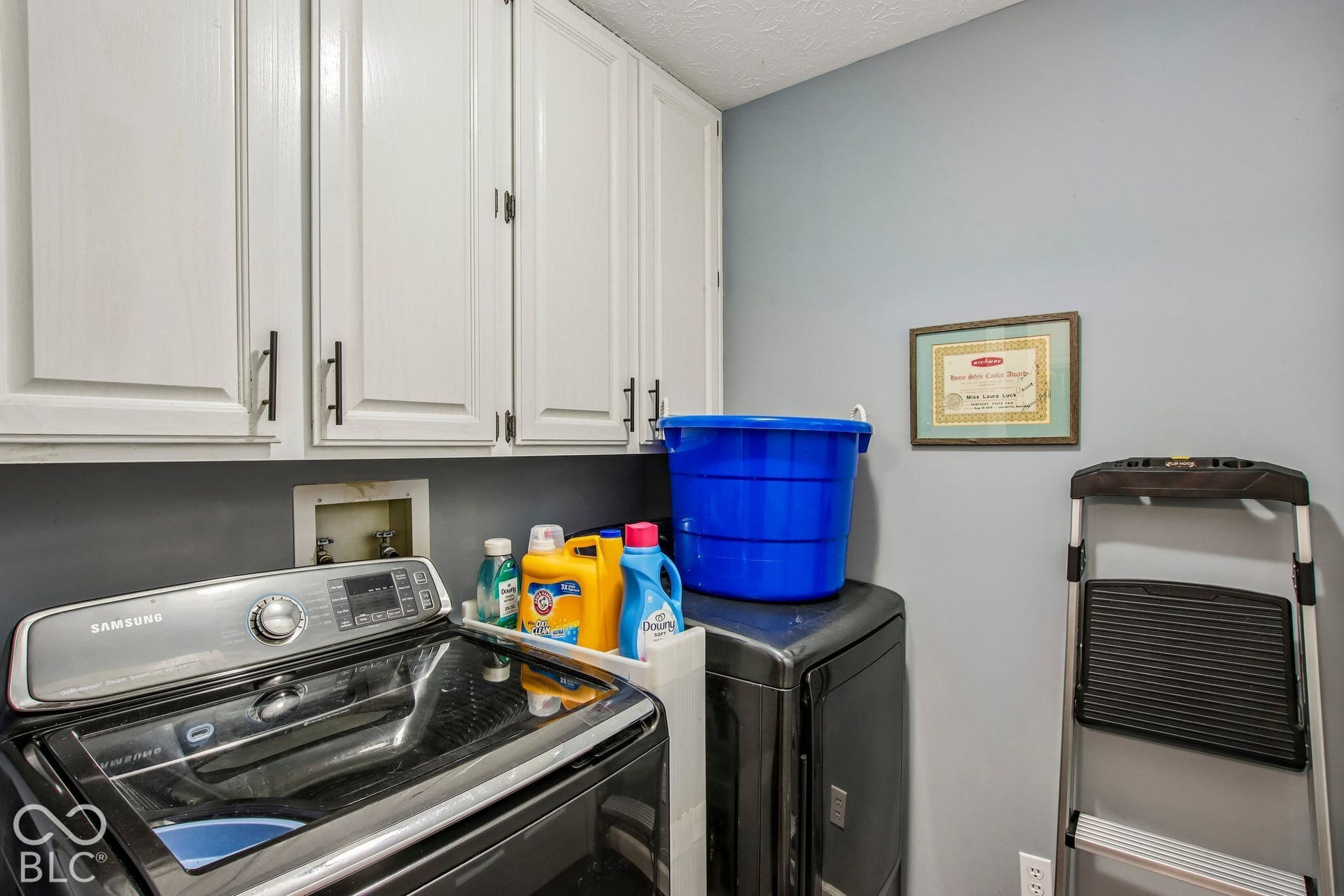 View of updated laundry room with cabinets. Washer & Dryer are included