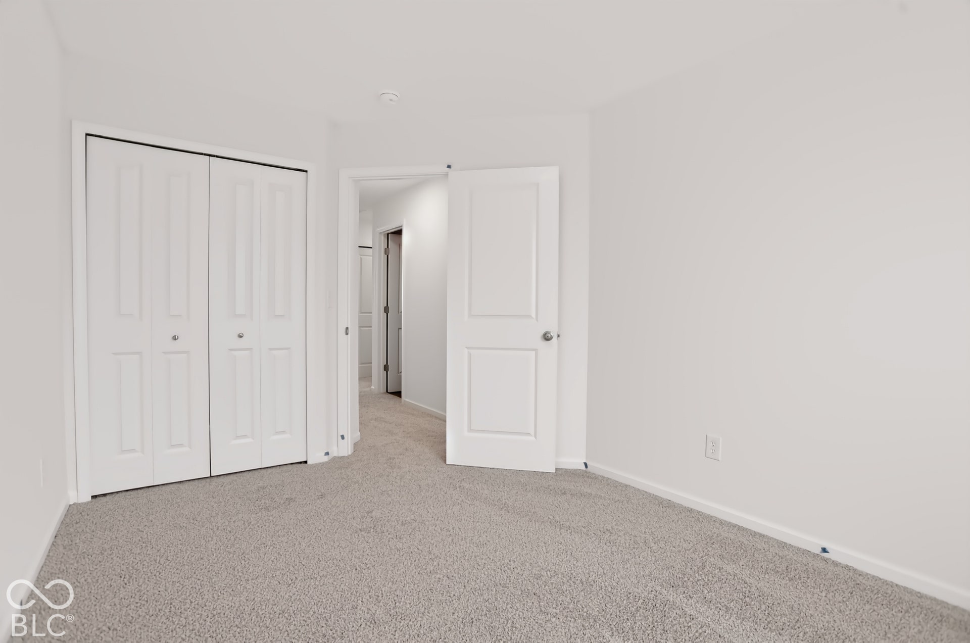 Neutral wall finishes and light-toned carpet flooring