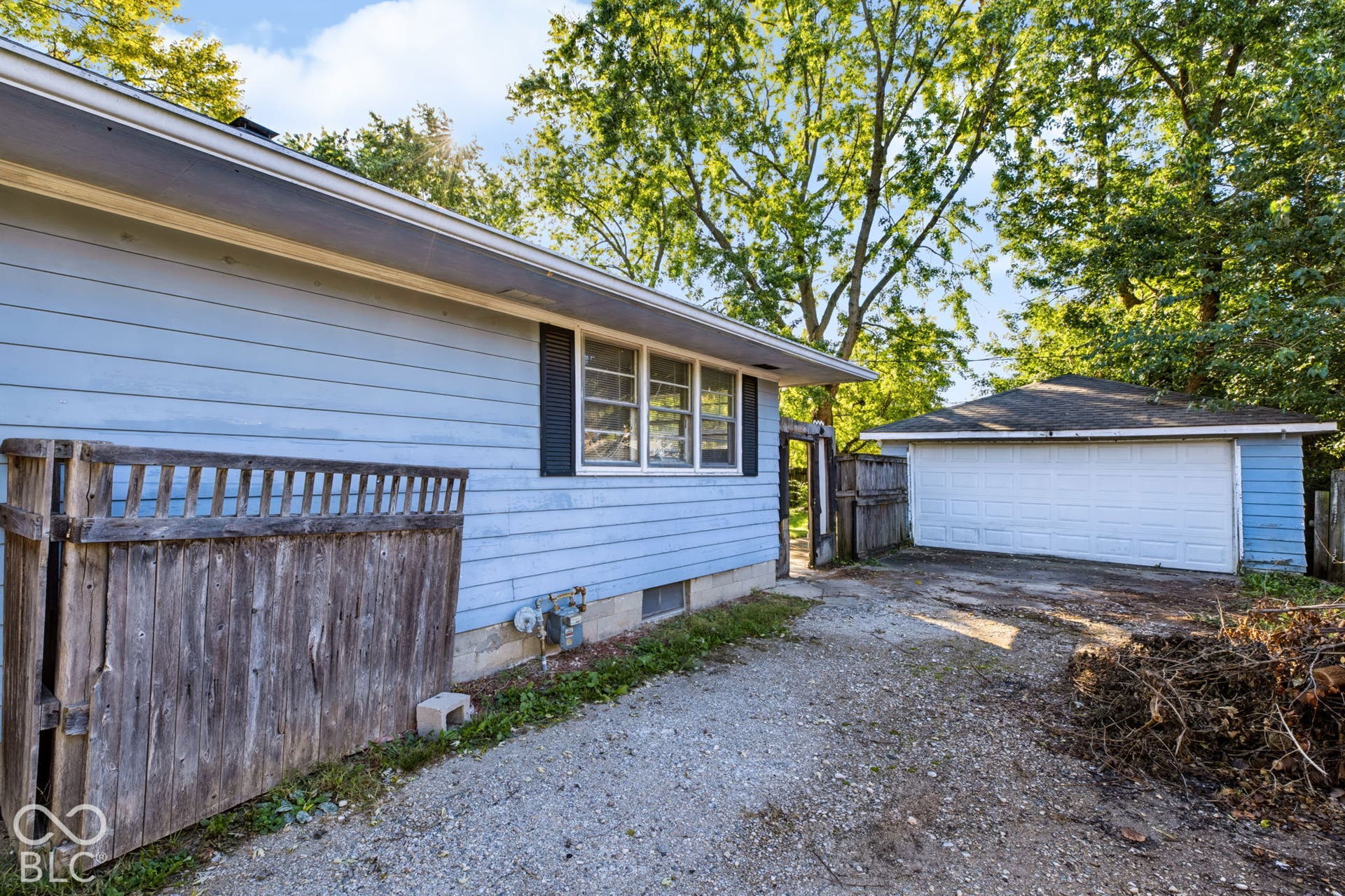 Detached garage with a white overhead door