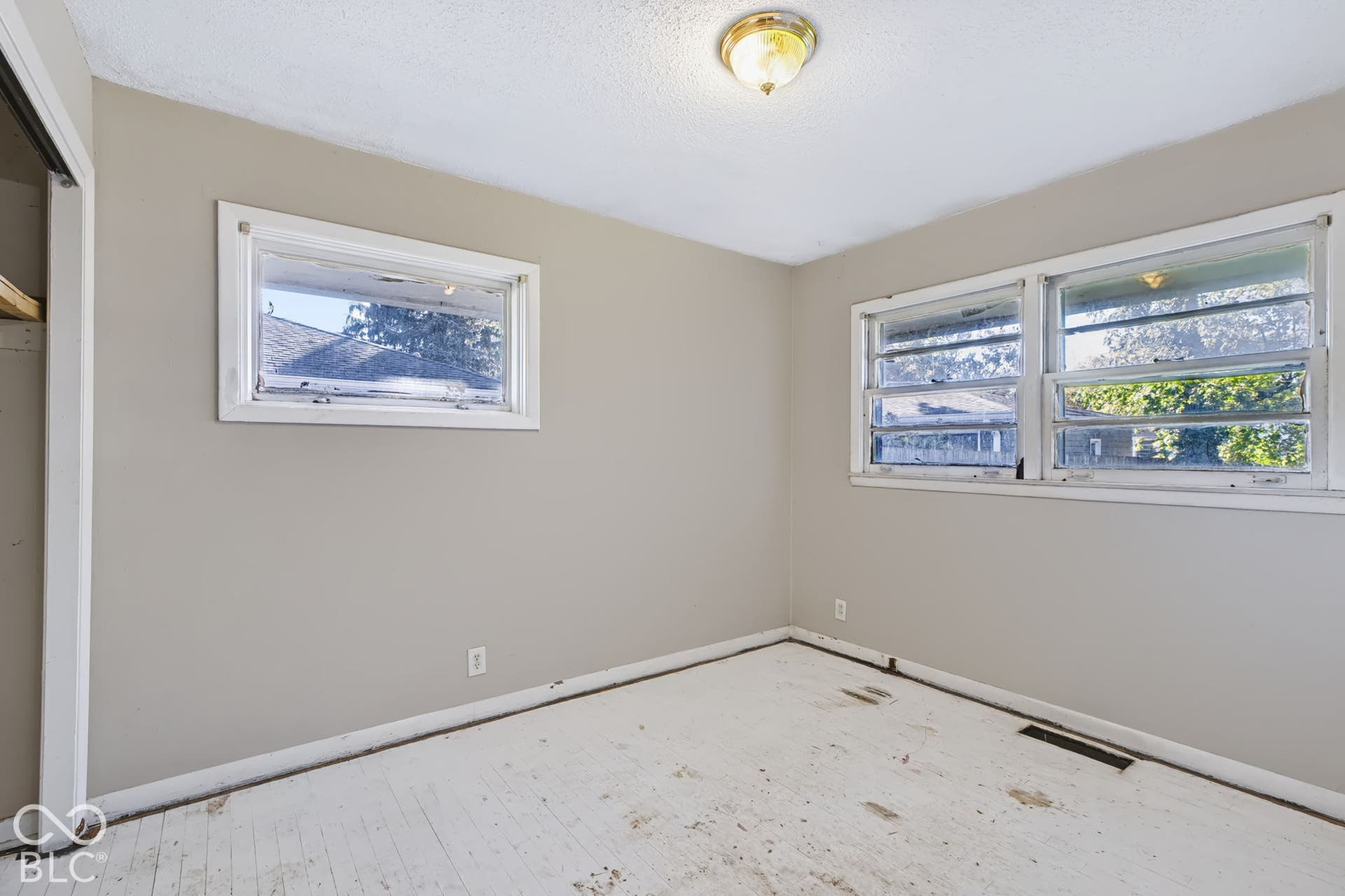 Neutral wall color with a semi-flush mount ceiling light