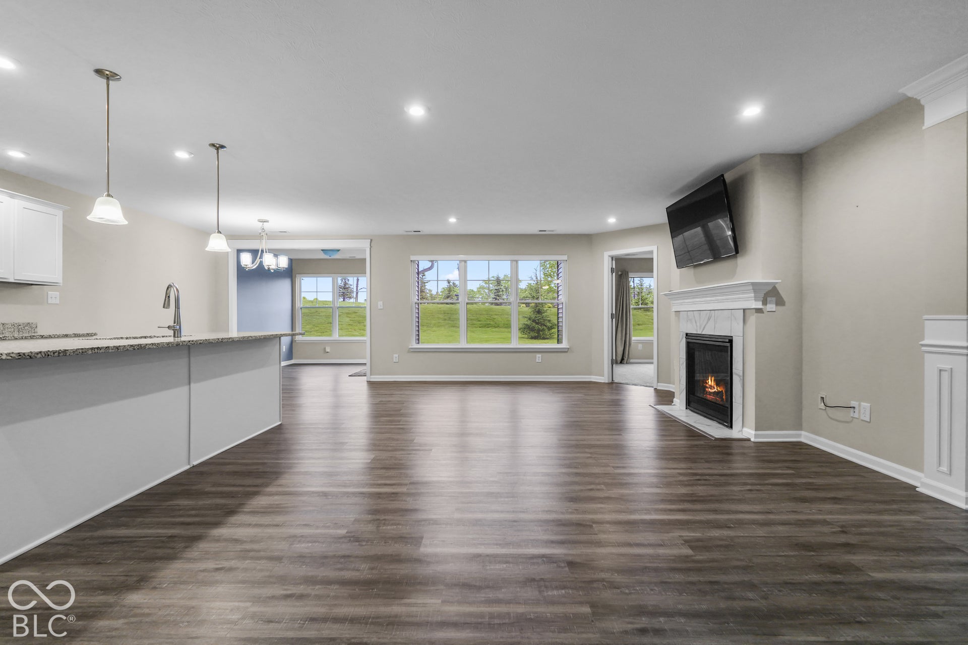 7141 Lillian Place, Cumberland, IN 46229 Open-concept living area featuring wood-finish flooring, fireplace