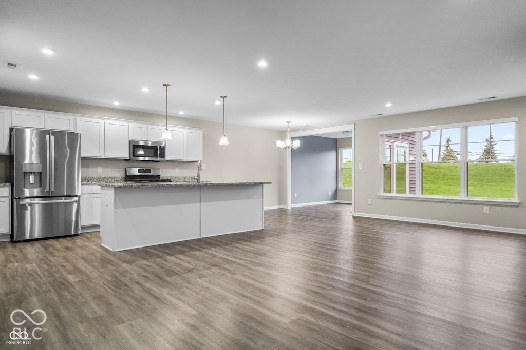 7141 Lillian Place, Cumberland, IN 46229 Open-concept living space with wood-finish flooring