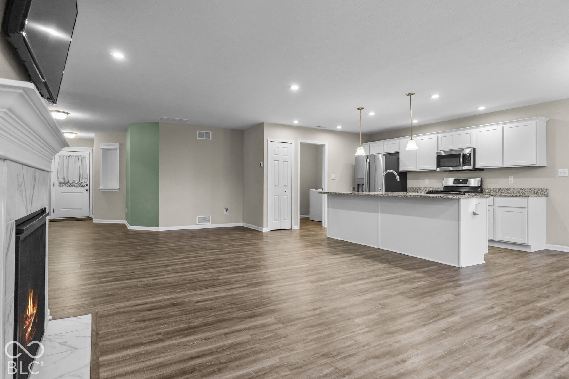 7141 Lillian Place, Cumberland, IN 46229 Open-concept layout with a fireplace & mantel