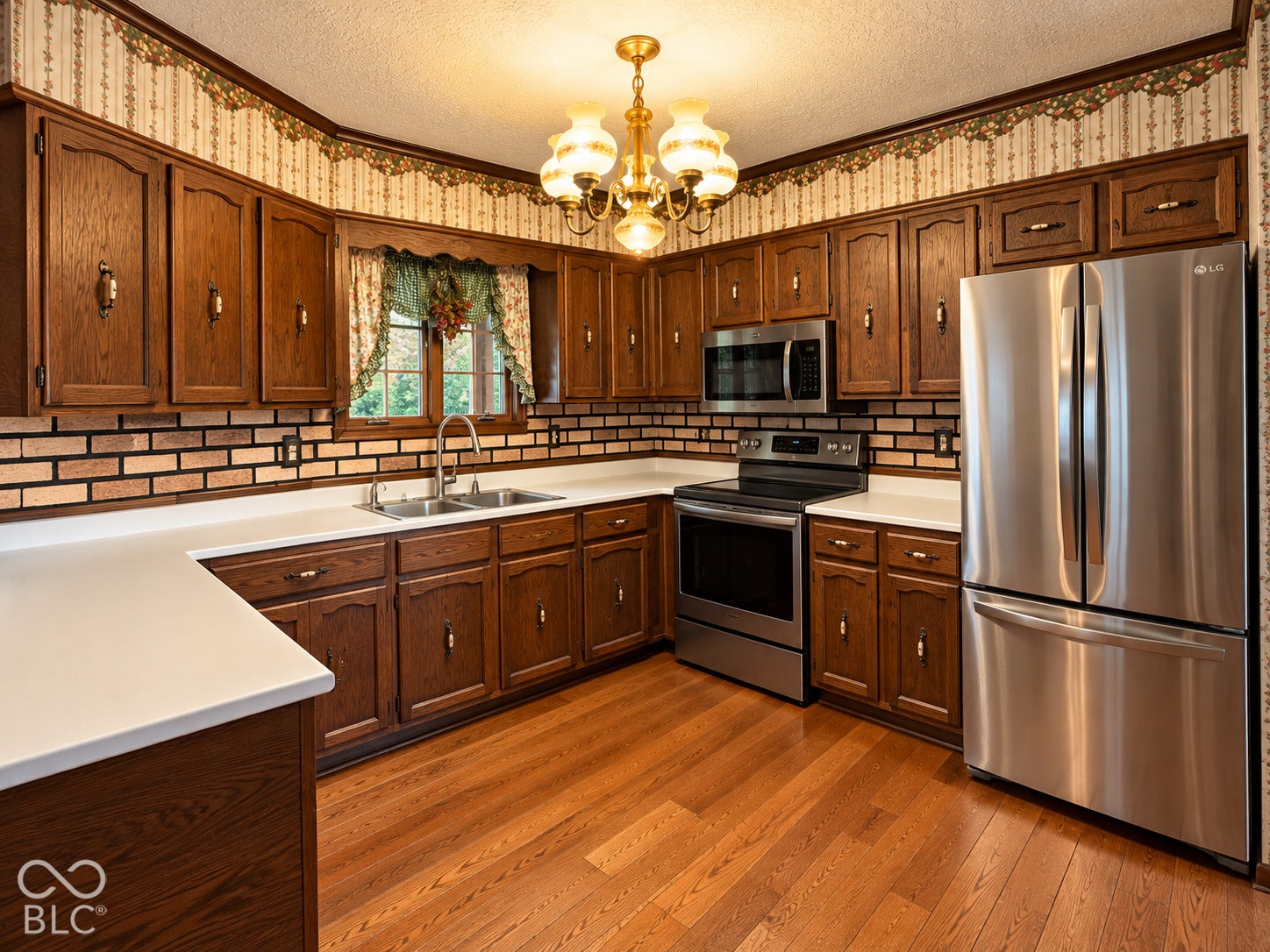 3680 S State Road 75, Coatesville, IN 46121 Wood-finish cabinetry paired with white countertops and wood-finish flooring