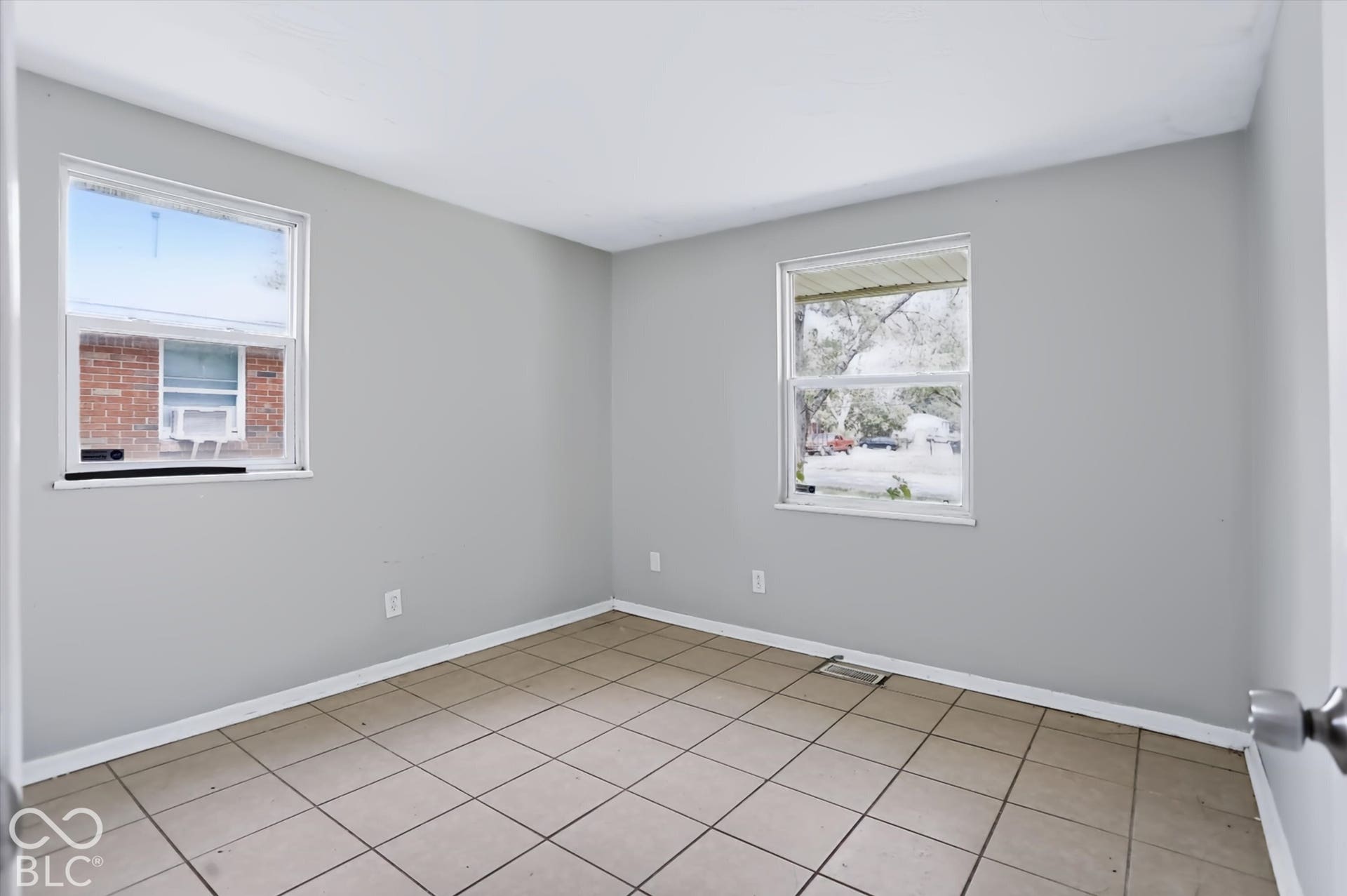 Tile flooring and light gray painted walls