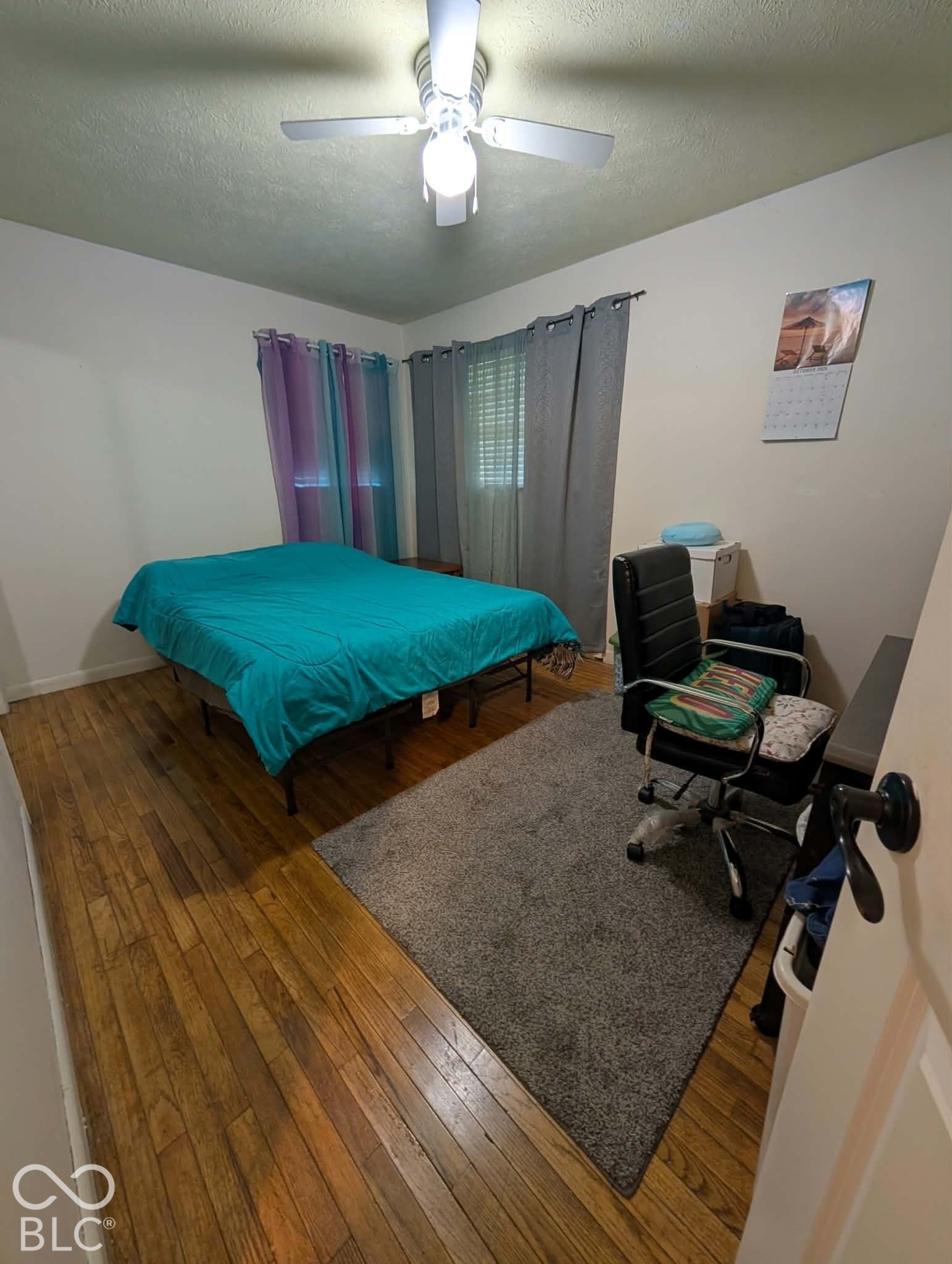Bedroom 1 with original hardwood floors