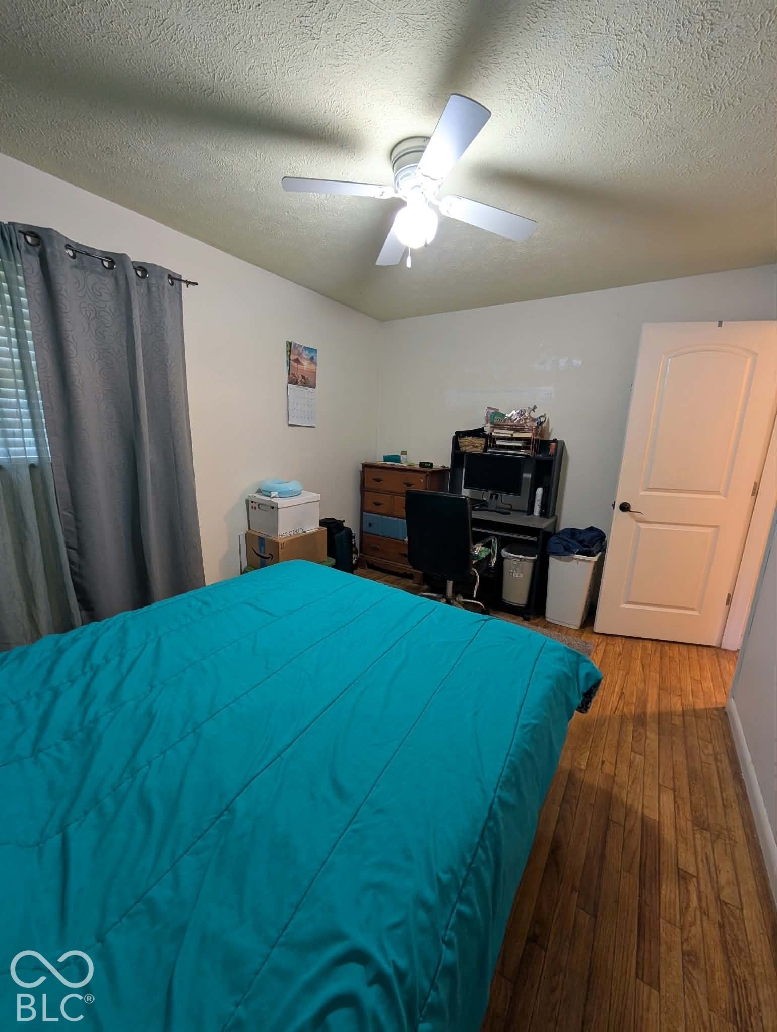 Bedroom 1 with original hardwood floors