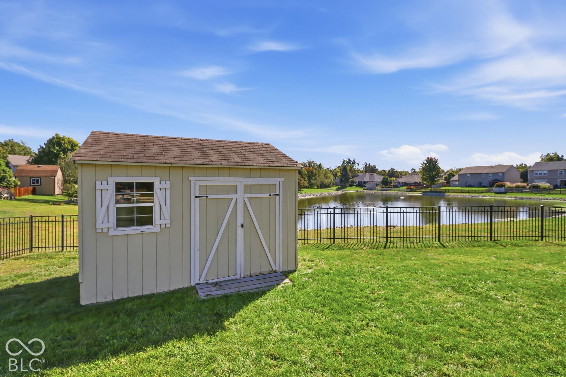 8035 Meadow Bend Lane, Indianapolis, IN 46259 12x10 storage shed in backyard creating additional storage space.