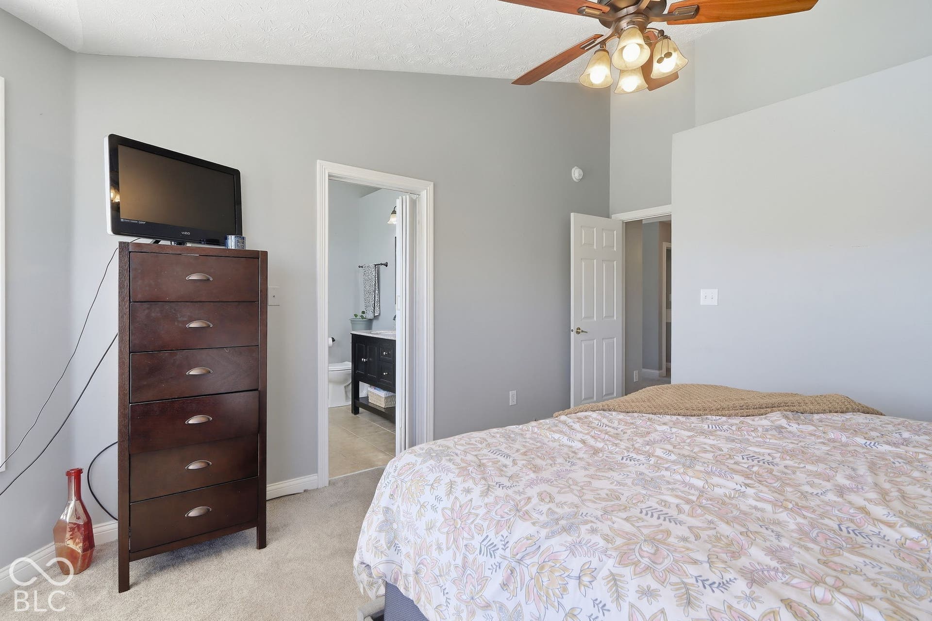 8035 Meadow Bend Lane, Indianapolis, IN 46259 Vaulted ceiling with an attached ceiling fan and light fixture