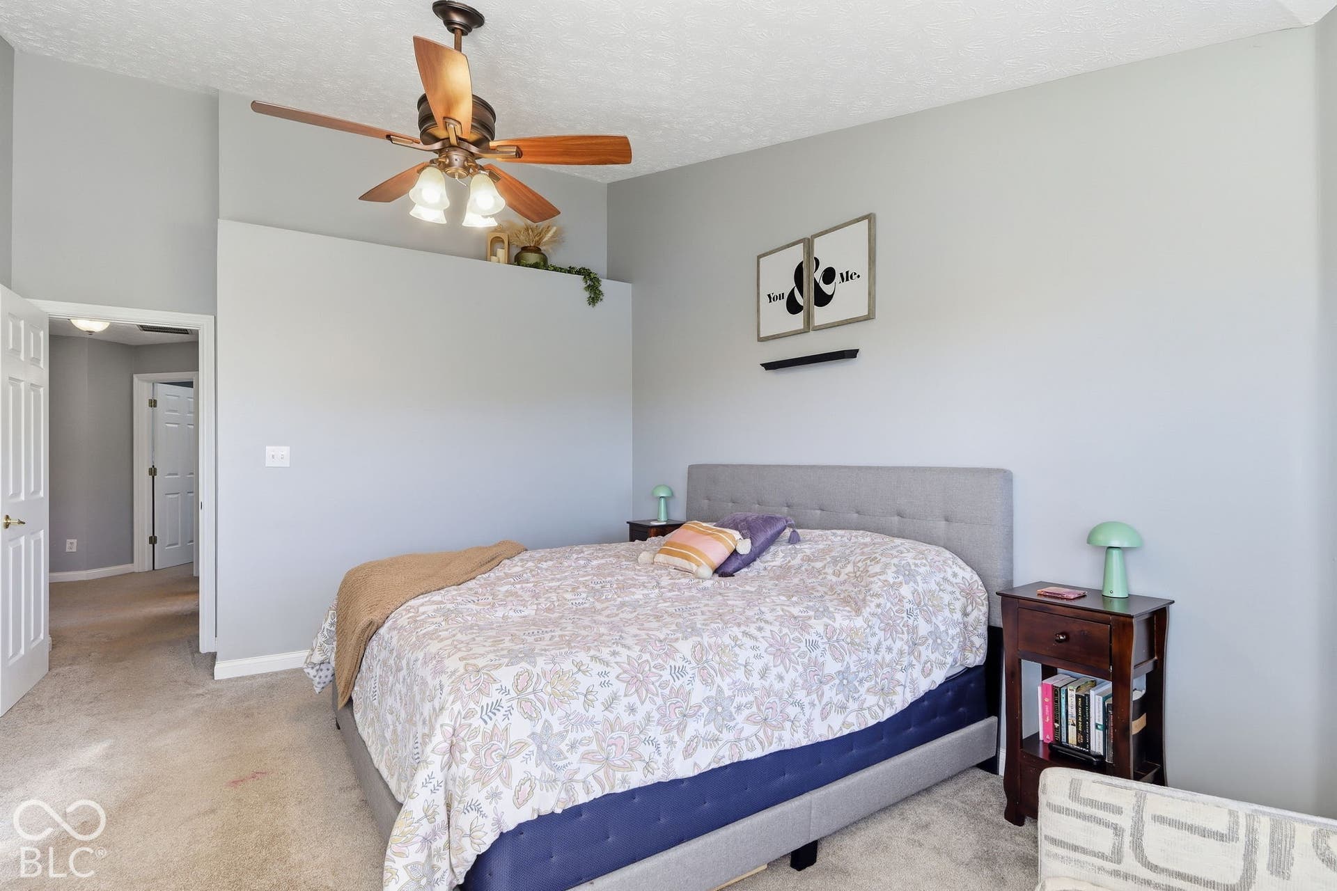 8035 Meadow Bend Lane, Indianapolis, IN 46259 Vaulted ceiling, ceiling fan with light fixture, carpeted flooring, paneled interior doors, and built-in architectural ledge