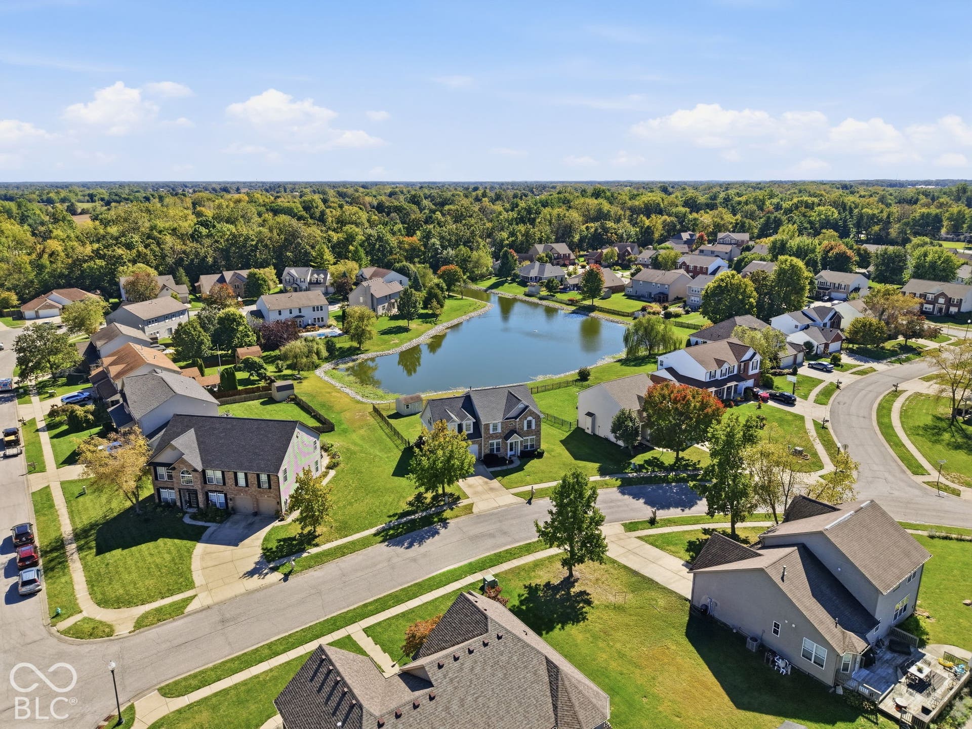 8035 Meadow Bend Lane, Indianapolis, IN 46259 Residential neighborhood with a central pond and mature trees