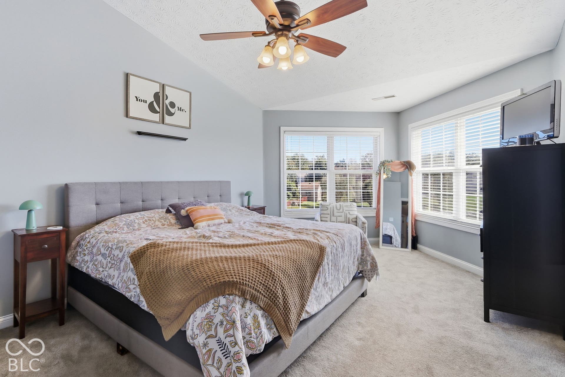 8035 Meadow Bend Lane, Indianapolis, IN 46259 Primary bedroom, lots of natural light. Vaulted ceiling with a\ ceiling fan and lights.