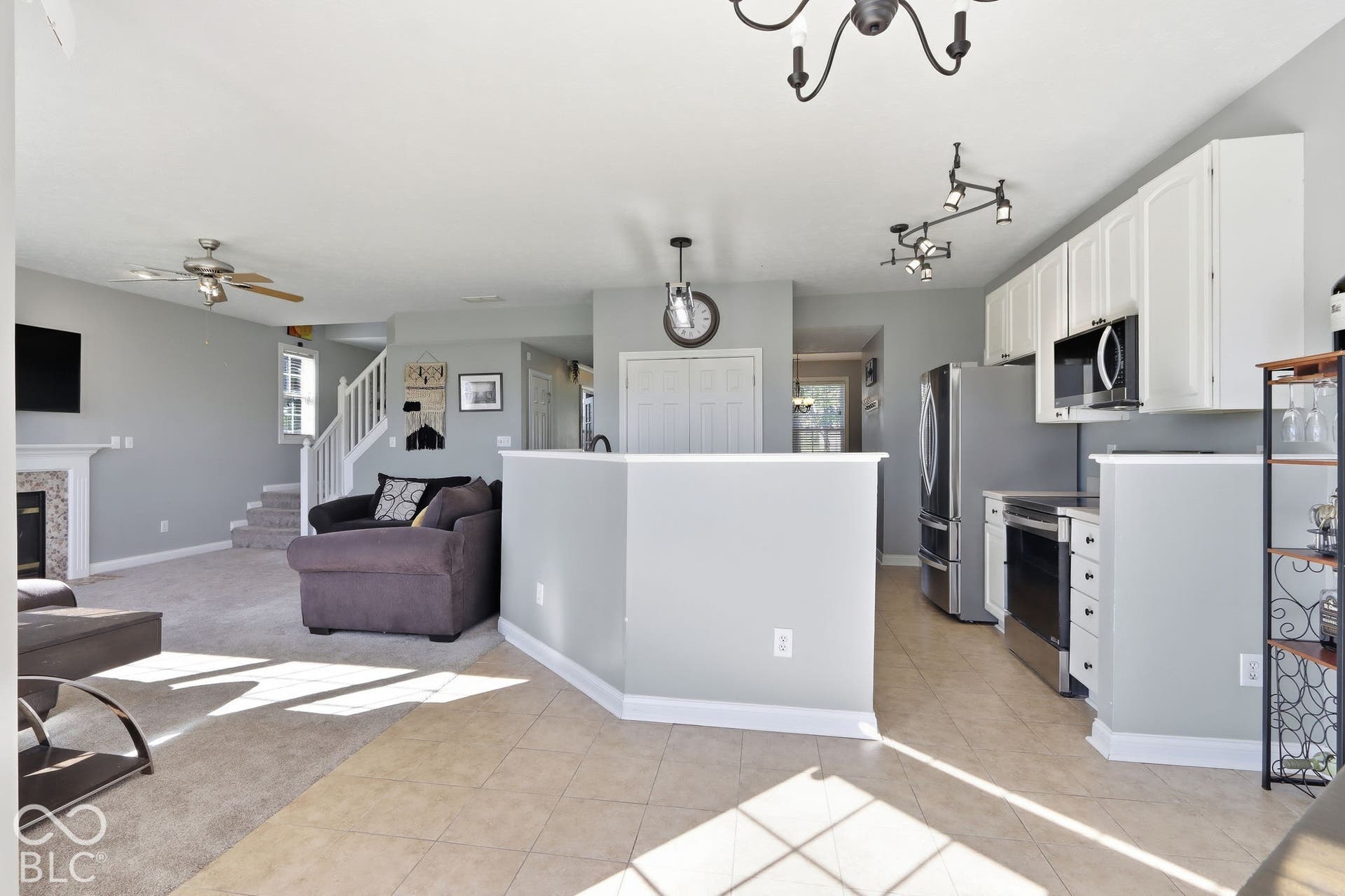 8035 Meadow Bend Lane, Indianapolis, IN 46259 Open-concept living space with tiled flooring and carpeted areas