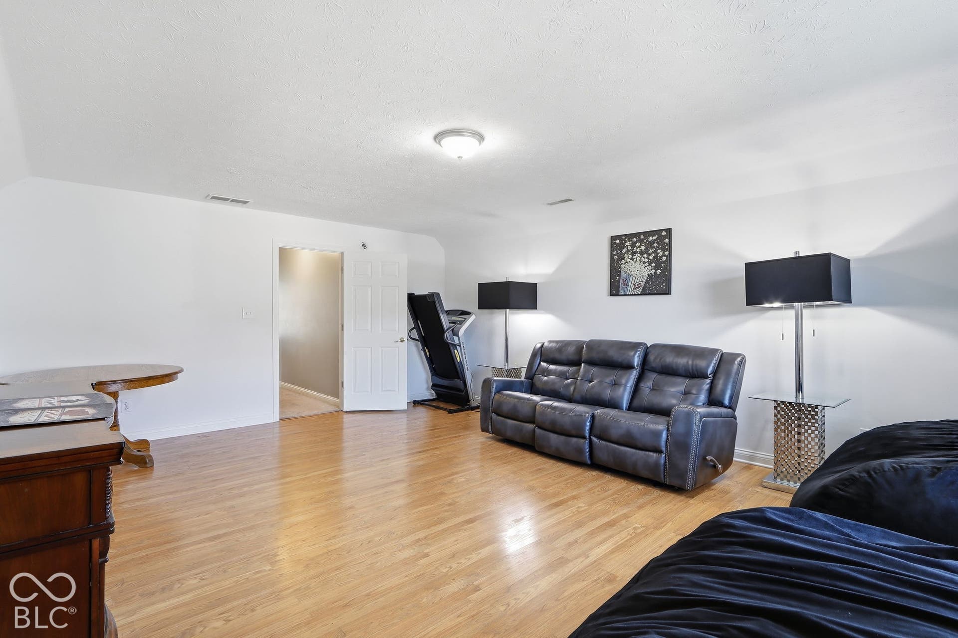 8035 Meadow Bend Lane, Indianapolis, IN 46259 Hardwood flooring throughout, white painted walls, and a recessed ceiling light