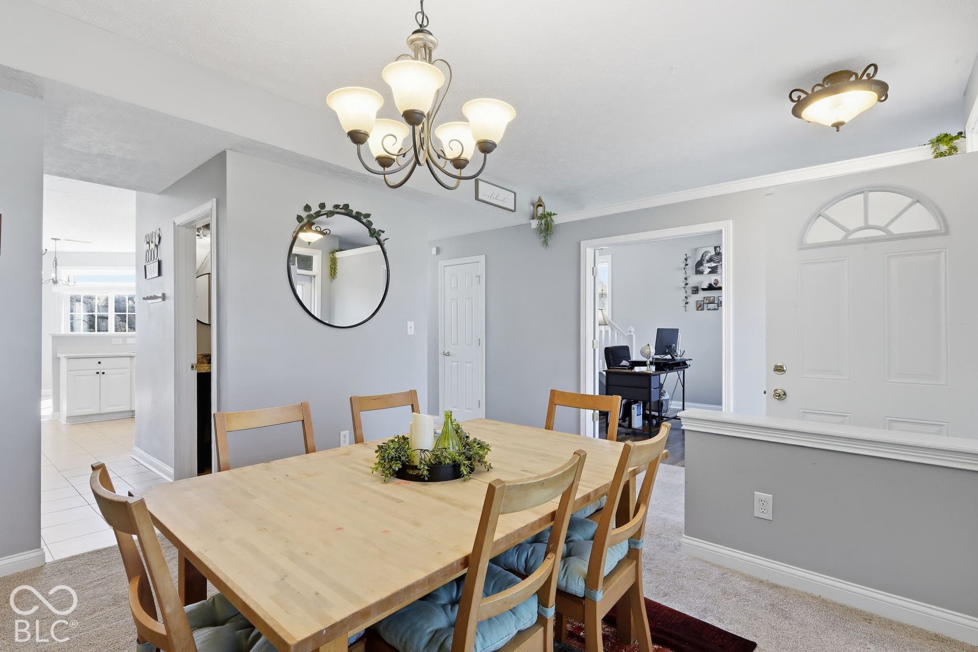 8035 Meadow Bend Lane, Indianapolis, IN 46259 Dining area featuring a five-light chandelier and carpeted flooring