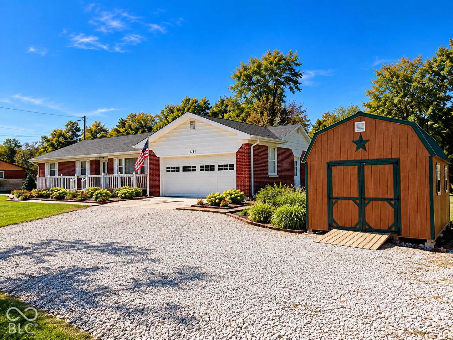 Red brick exterior with white siding accents