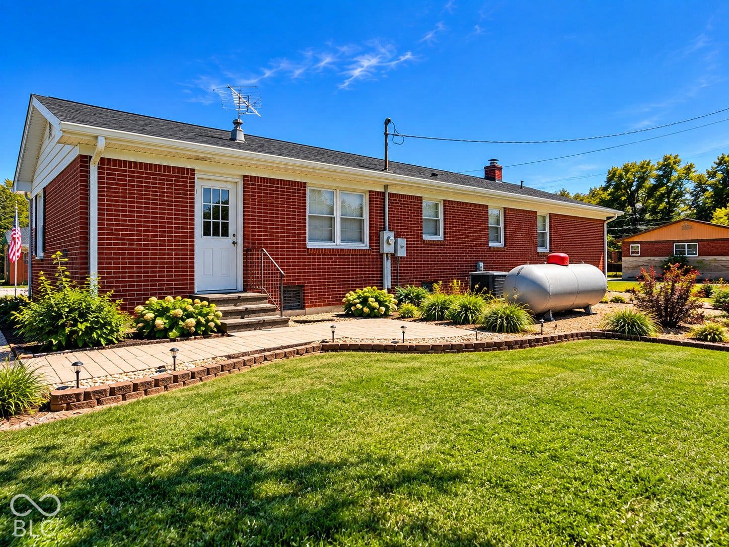 Red brick exterior with white trim