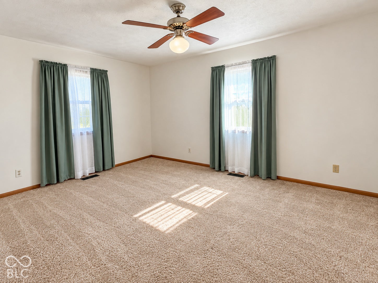 Neutral wall paint and carpeted flooring