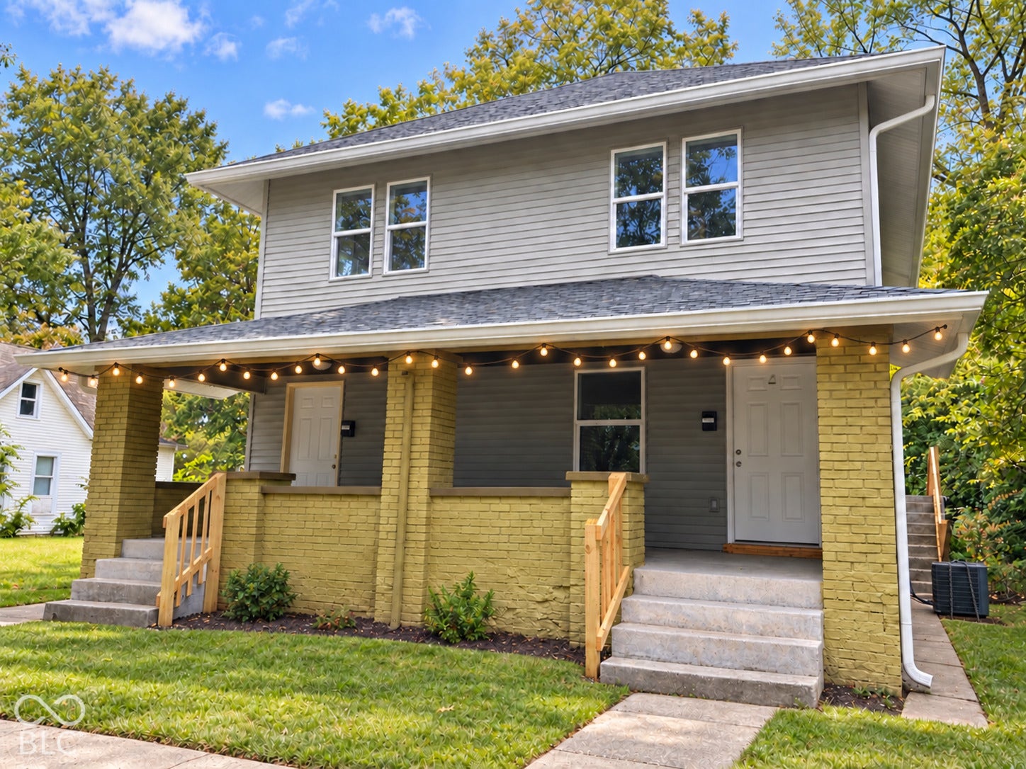 Two-story exterior with horizontal siding and a dark shingle roof