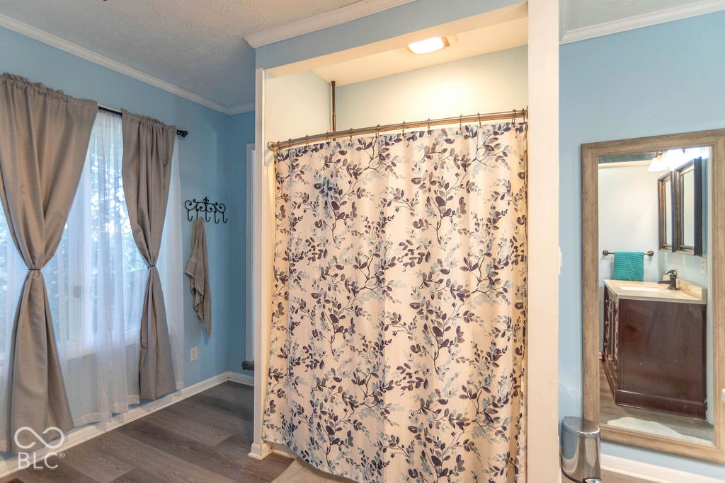 Wood-finish flooring with light blue walls