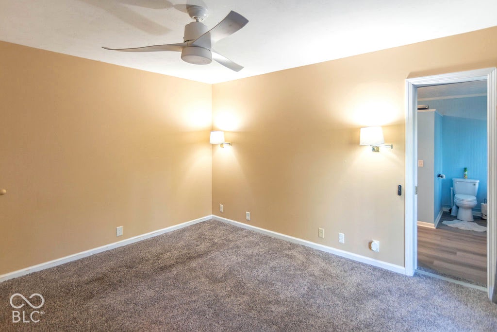 Recessed lighting, ceiling fan, wall-mounted sconces, and carpeting