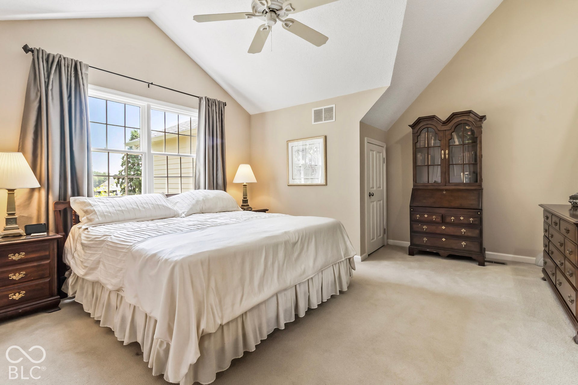 10954 N County Road 150 Road E, Pittsboro, IN 46167 Vaulted ceiling with a white overhead fan, neutral carpeting, and grid-patterned windows