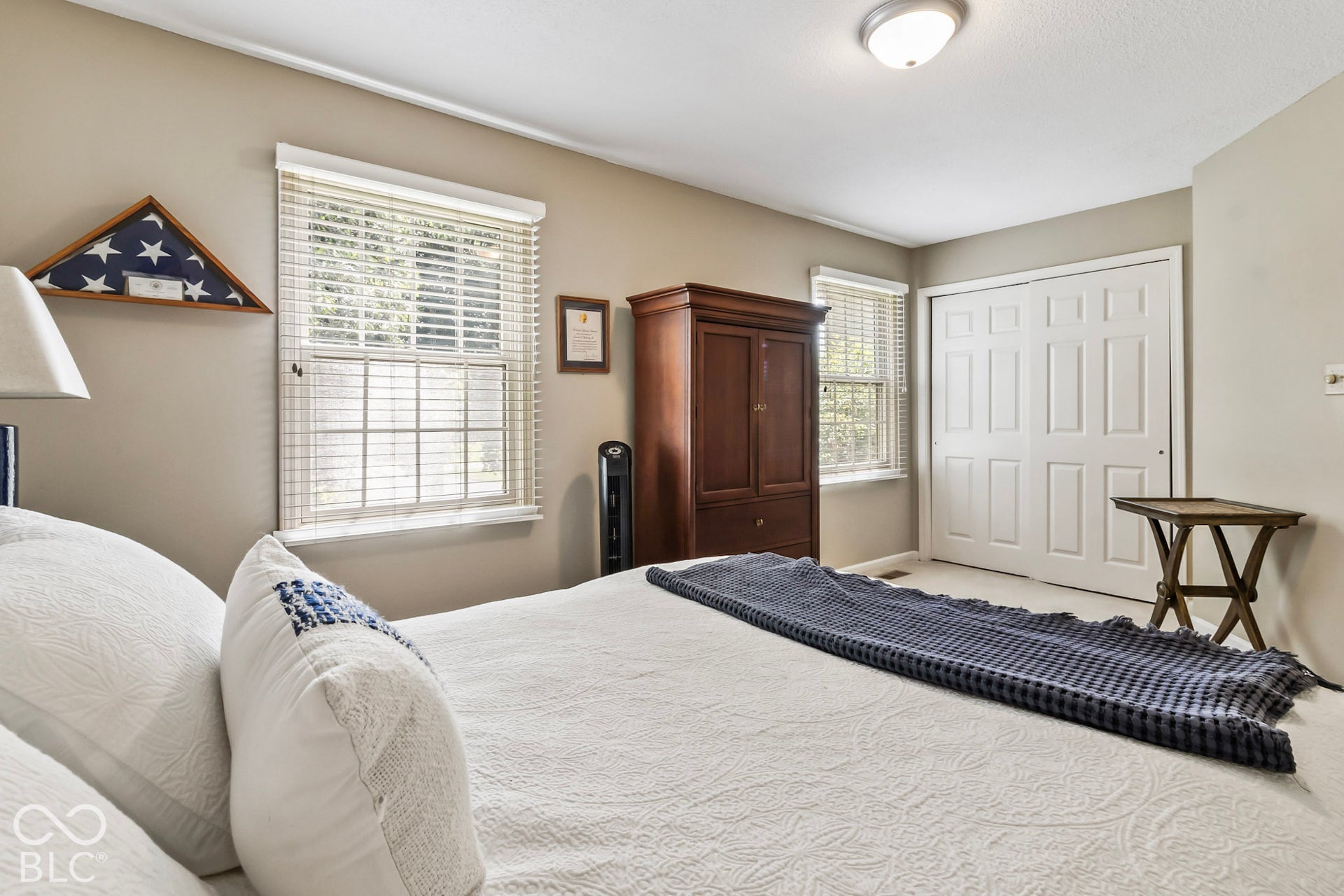 10954 N County Road 150 Road E, Pittsboro, IN 46167 Neutral interior with two large windows featuring horizontal blinds, dual-panel sliding closet doors, and flush-mount ceiling lighting