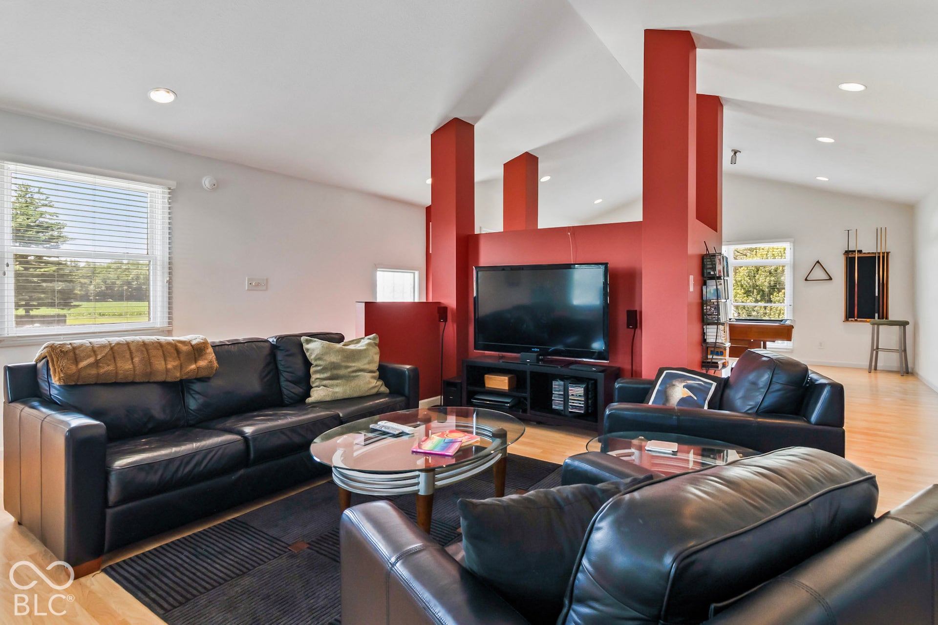 10954 N County Road 150 Road E, Pittsboro, IN 46167 Vaulted ceilings, wood-finish flooring, recessed lighting, and a central architectural pillar divider