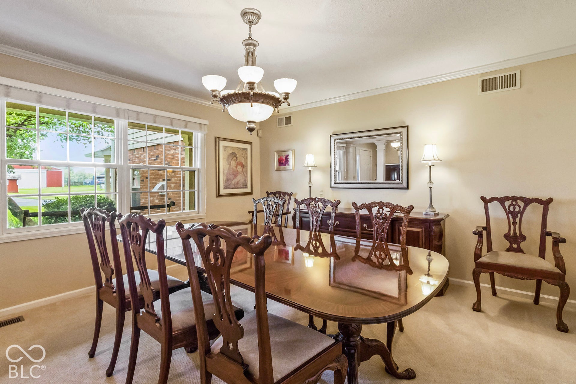10954 N County Road 150 Road E, Pittsboro, IN 46167 Multi-pane window, crown molding, and tiered five-light chandelier
