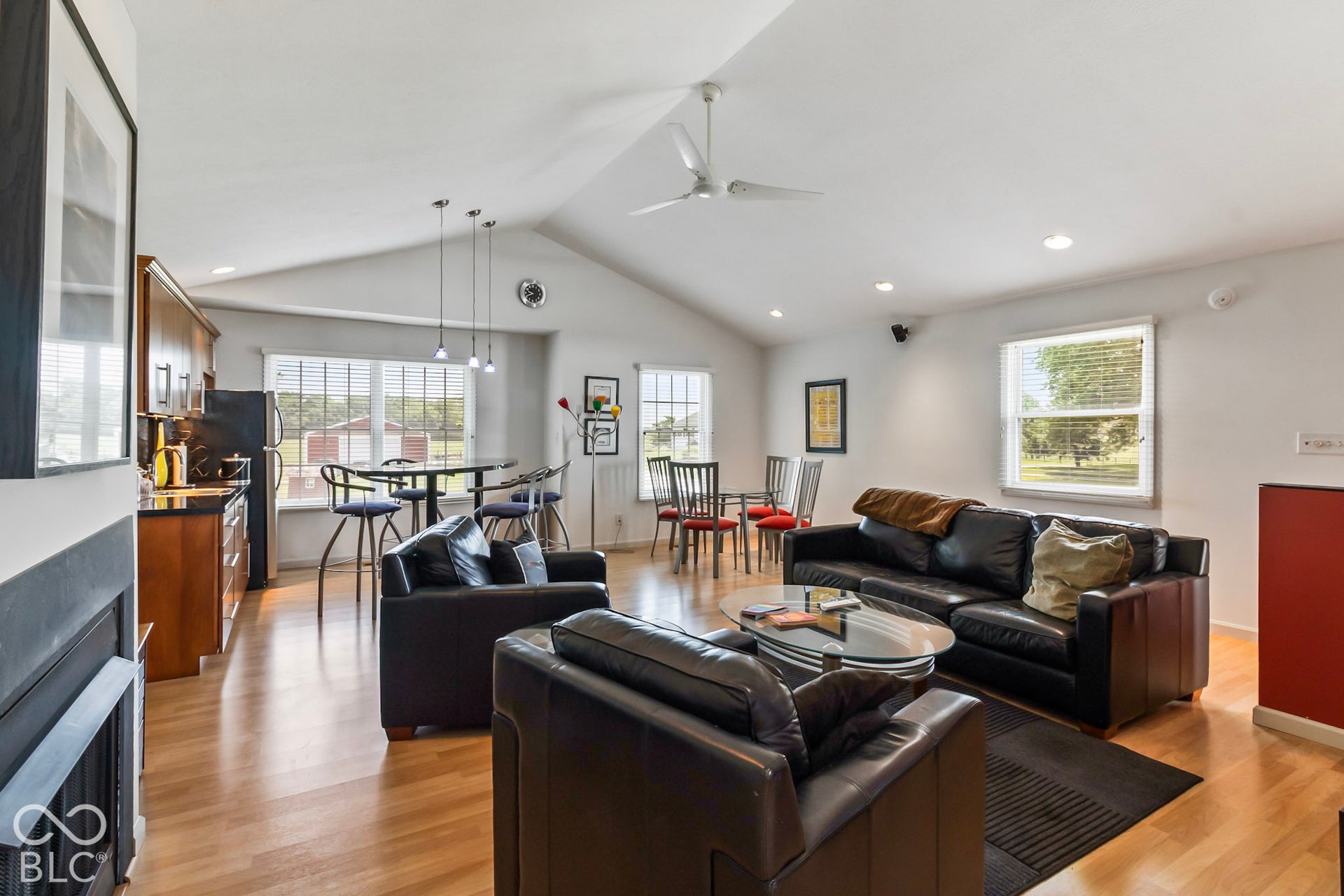 10954 N County Road 150 Road E, Pittsboro, IN 46167 Vaulted ceilings, wood-finish flooring, recessed lighting, and a fireplace with a black surround