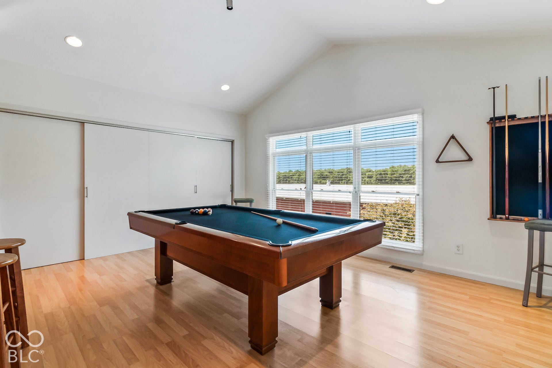10954 N County Road 150 Road E, Pittsboro, IN 46167 Vaulted ceilings, wood-finish flooring, recessed lighting, and large windows with horizontal blinds