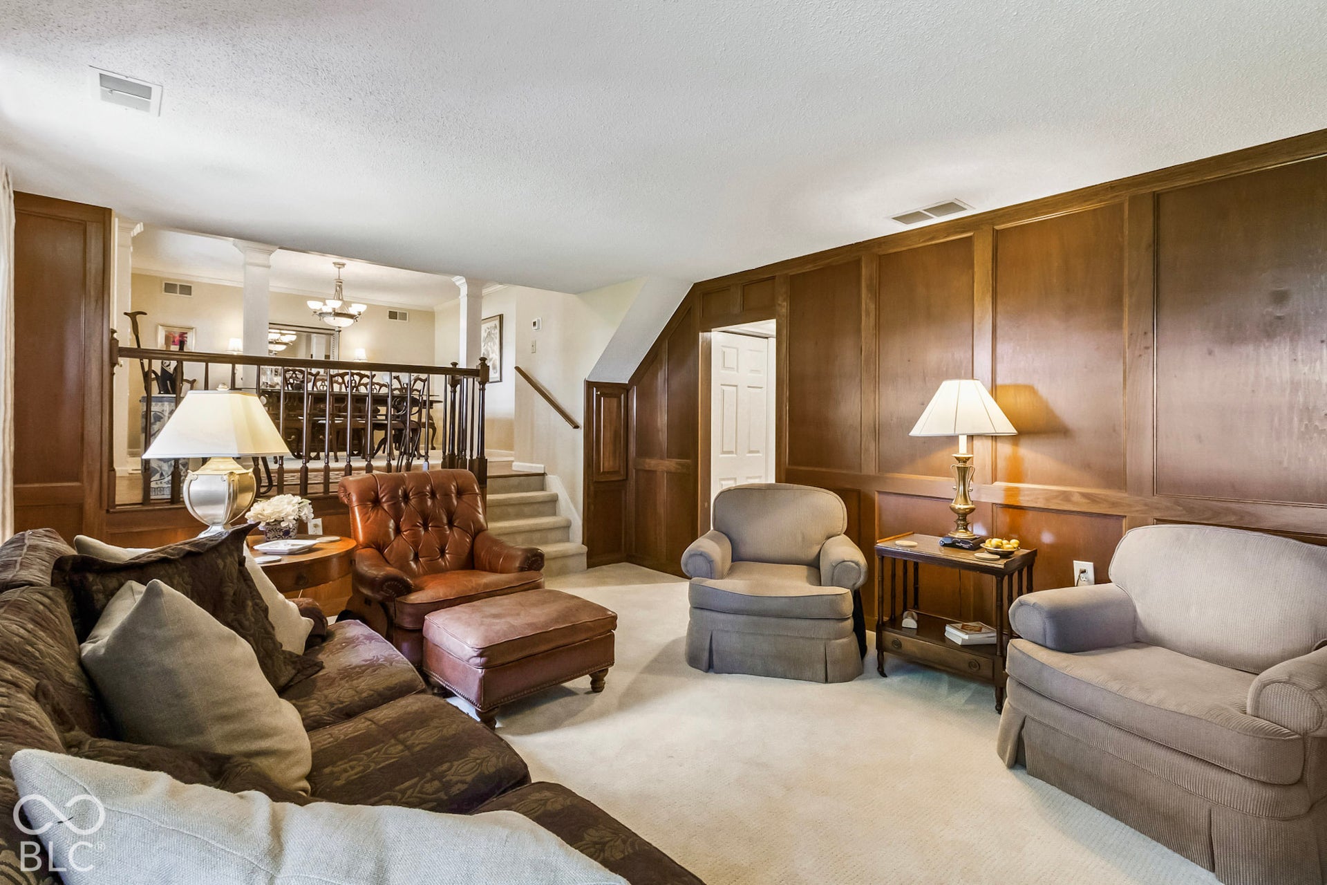 10954 N County Road 150 Road E, Pittsboro, IN 46167 Floor-to-ceiling wood paneling, wood-finished railings, and carpeted flooring
