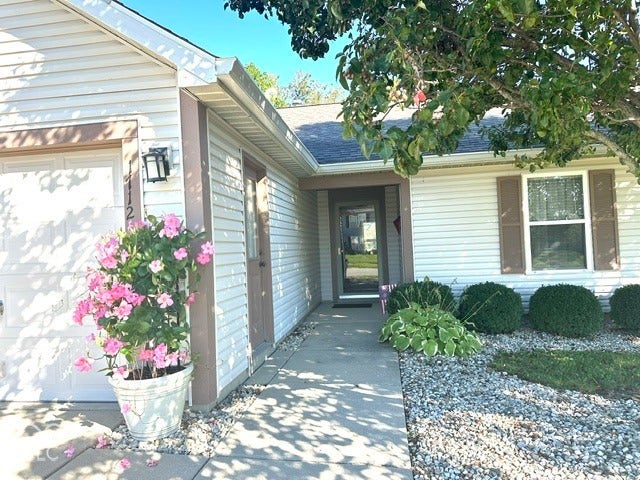 1712 Austin Drive, Lebanon, IN 46052 White horizontal siding exterior with brown window shutters